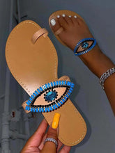 Slip-On-Sandalen mit bösem Blick